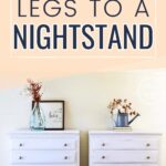 Two white nightstands with added legs, decorated with vases and art, against a light wall. Text above reads: Adding legs to a nightstand.