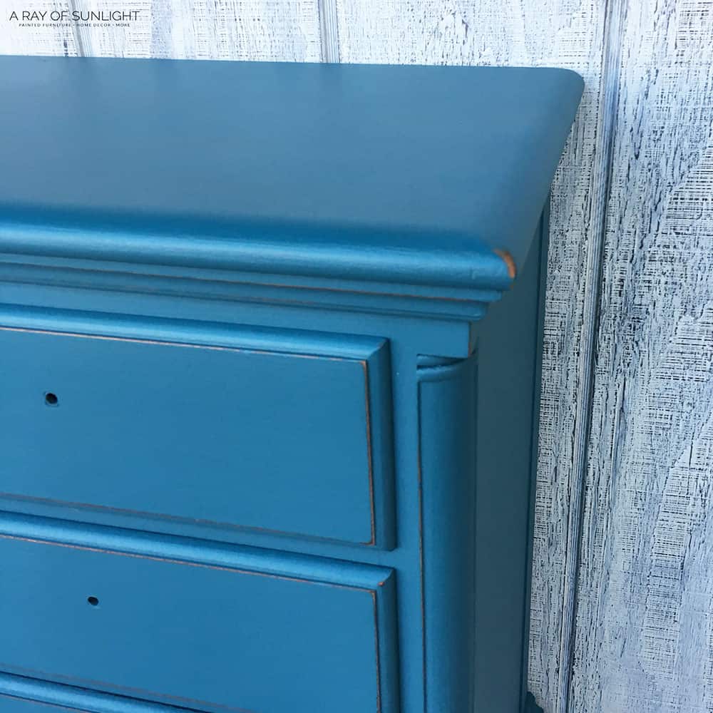closeup of the nightstand with distressed edges and no hardware