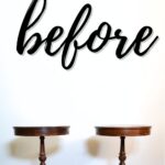Two round wooden side tables against a white wall