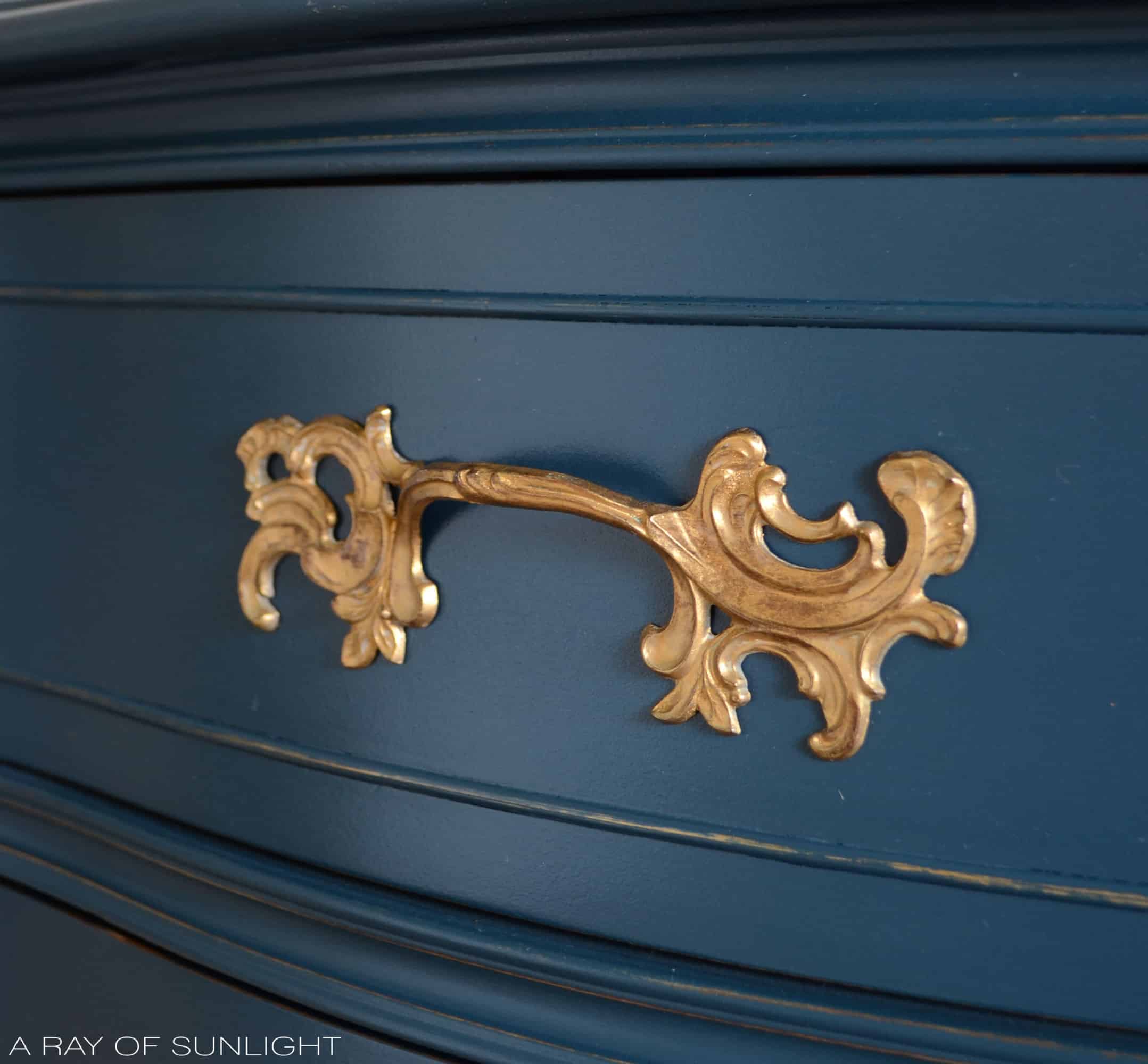 closeup of the french provincial hardware with rub n buff finish