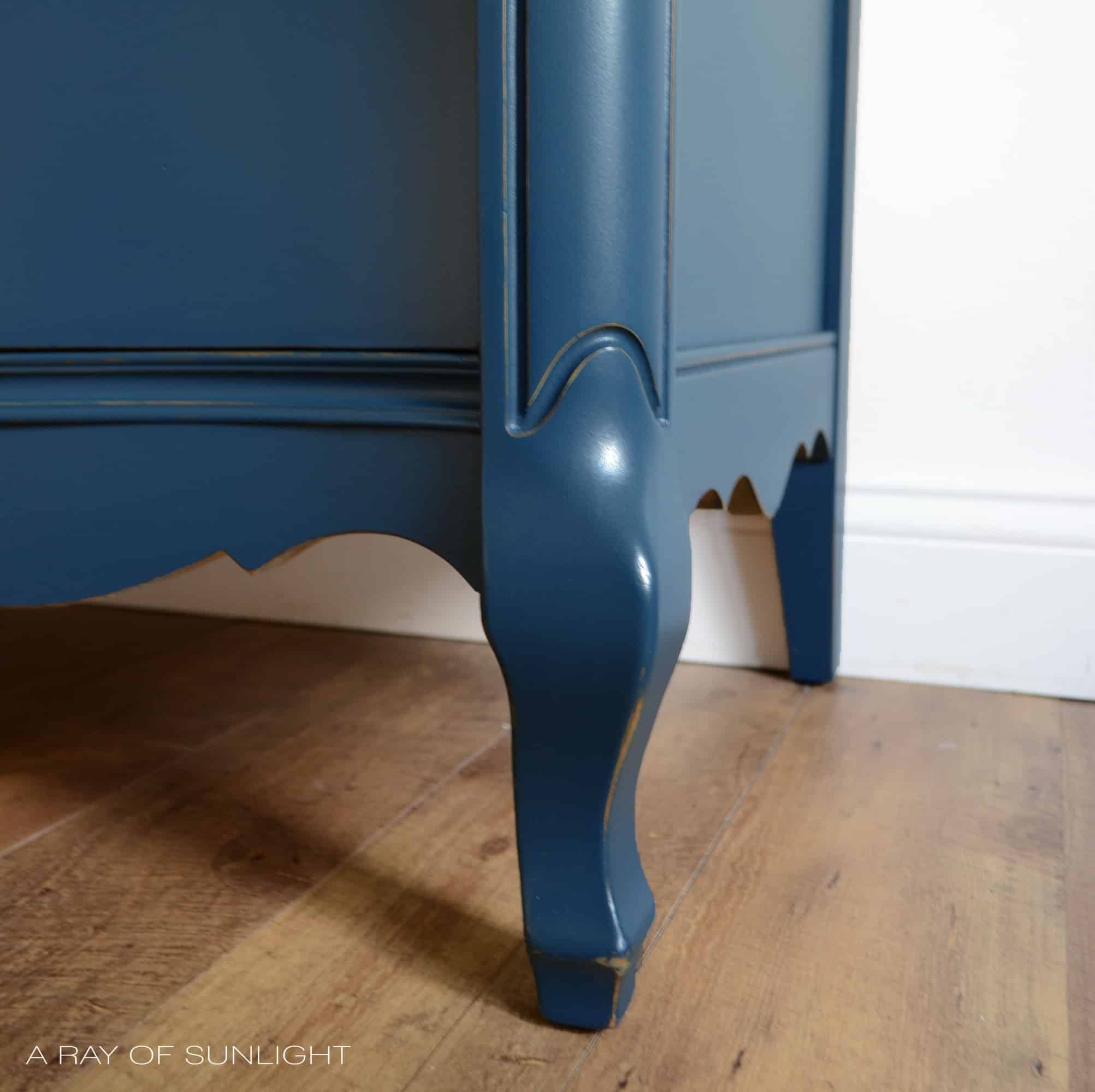 Learn how to create this navy blue finish with antique gold hardware for your own DIY furniture makeover. Painted in Country Chic Paint with the best affordable paint sprayer for refinishing furniture. By A Ray of Sunlight #paintedfurniture #navydresser #furnituremakeover #countrychicpaint #DIYfurniture
