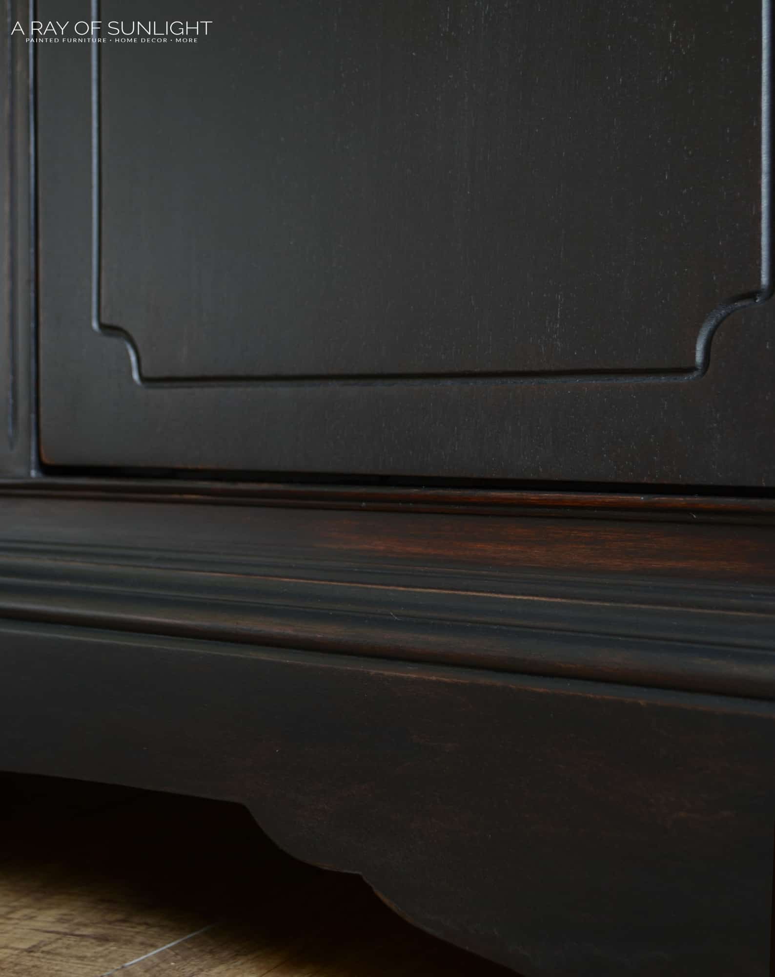 close up on the black weathered finish on the furniture after the makeover