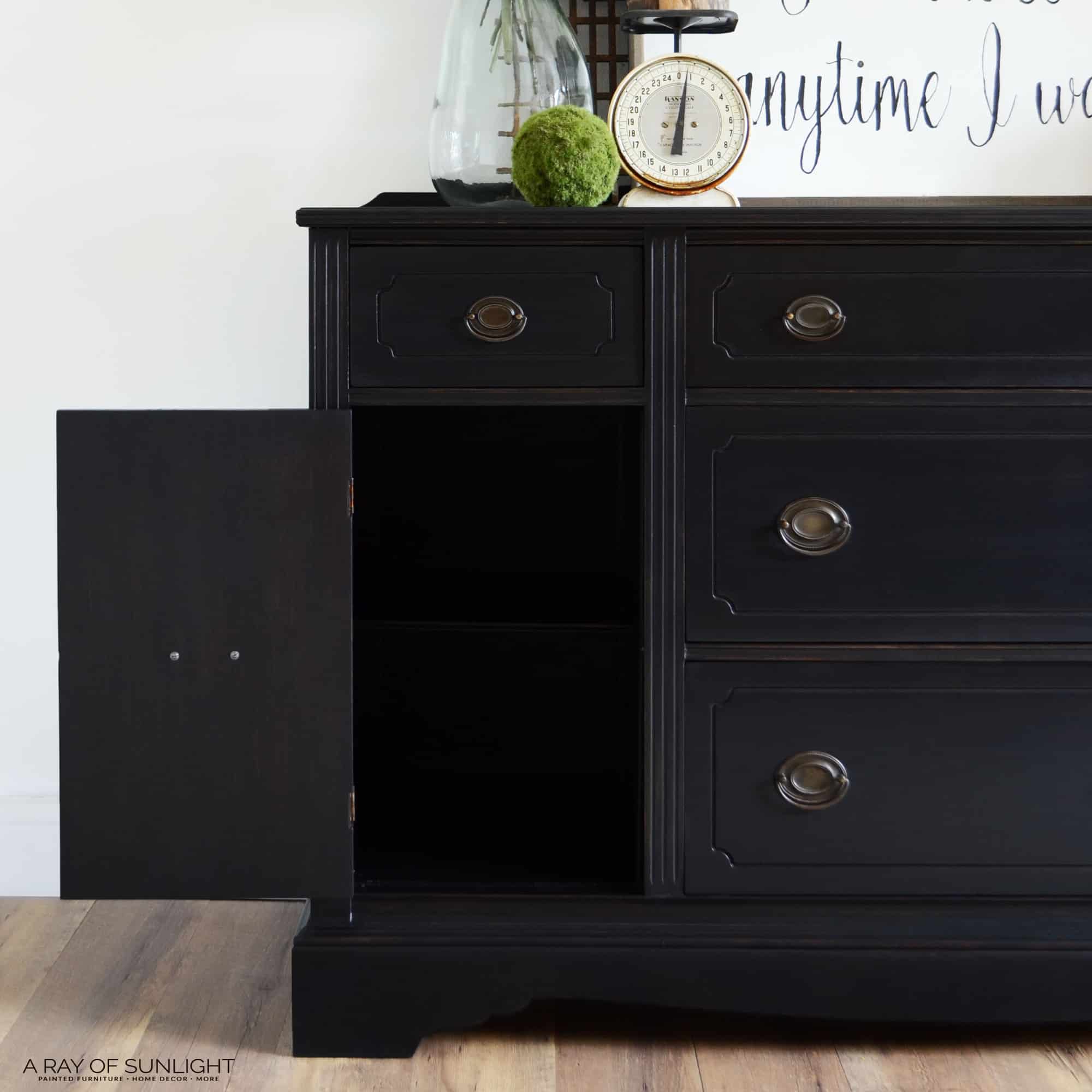 black painted vintage makeover with an open cabinet