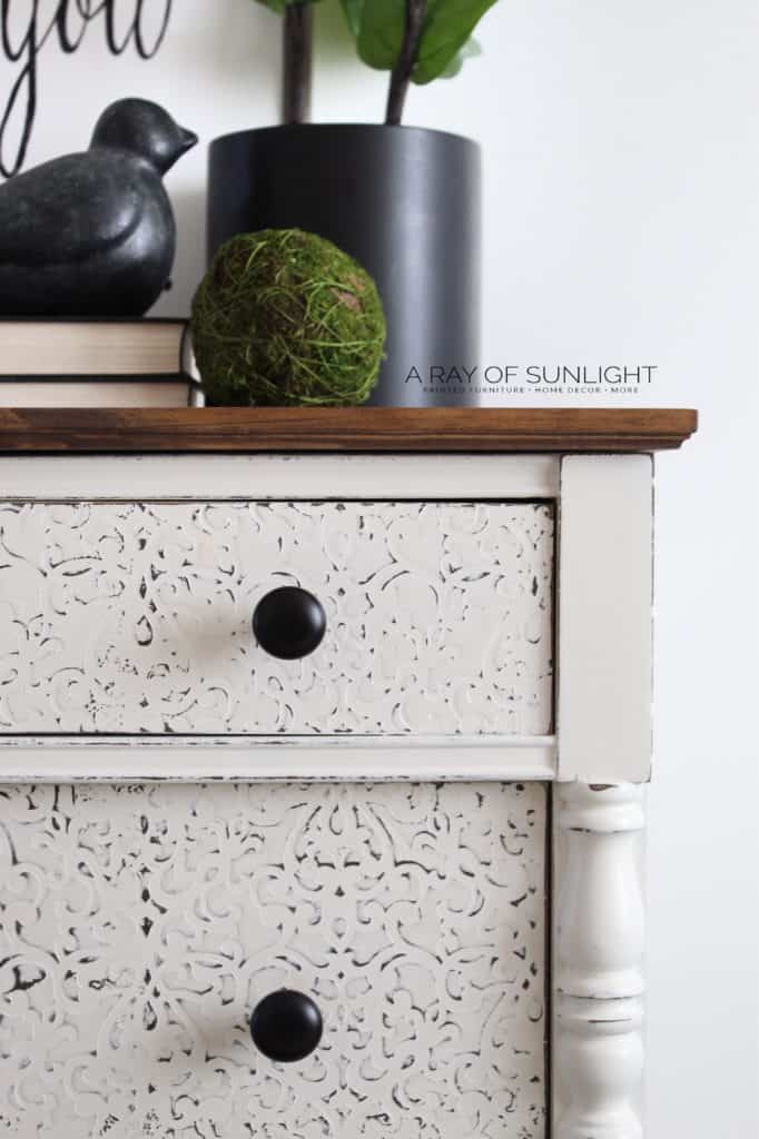 close up on dresser drawers with raised and textured stencil