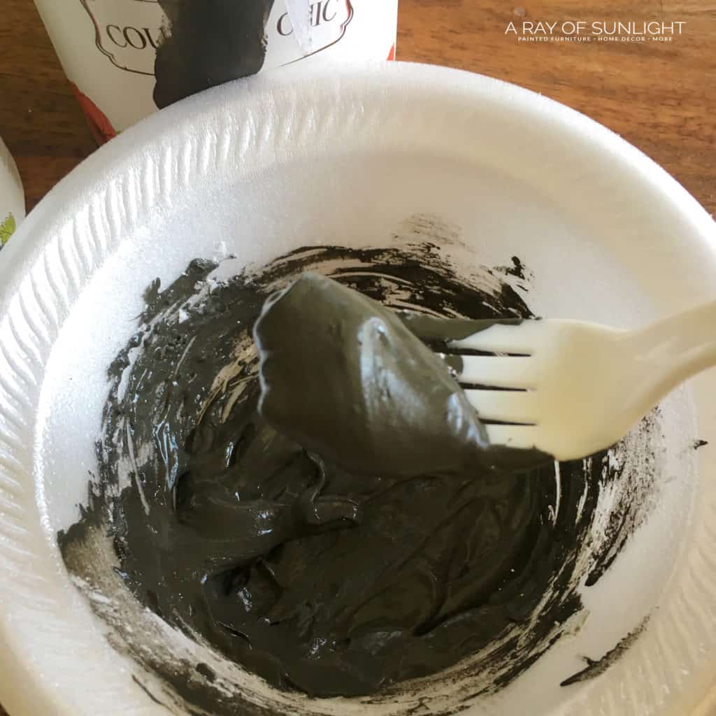 Black paint and texture powder mixed together to make a peanut butter consistency