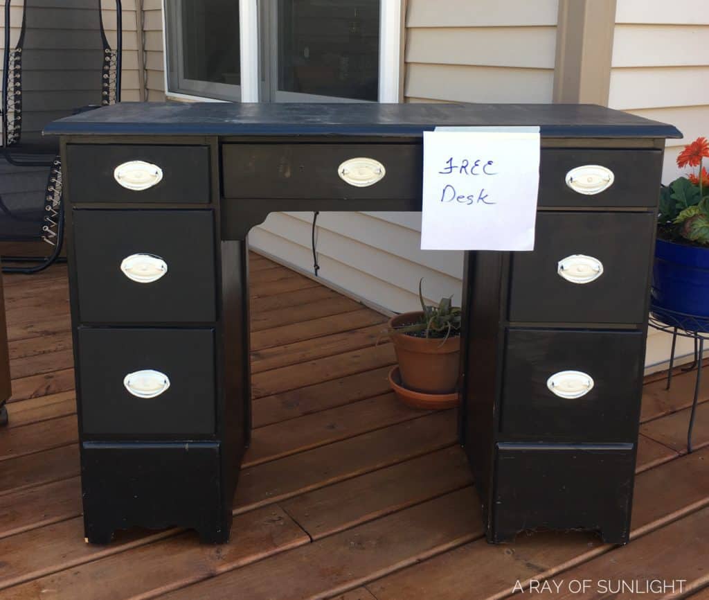 photo of a free desk at a yard sale, which is a place to find the best budget furniture