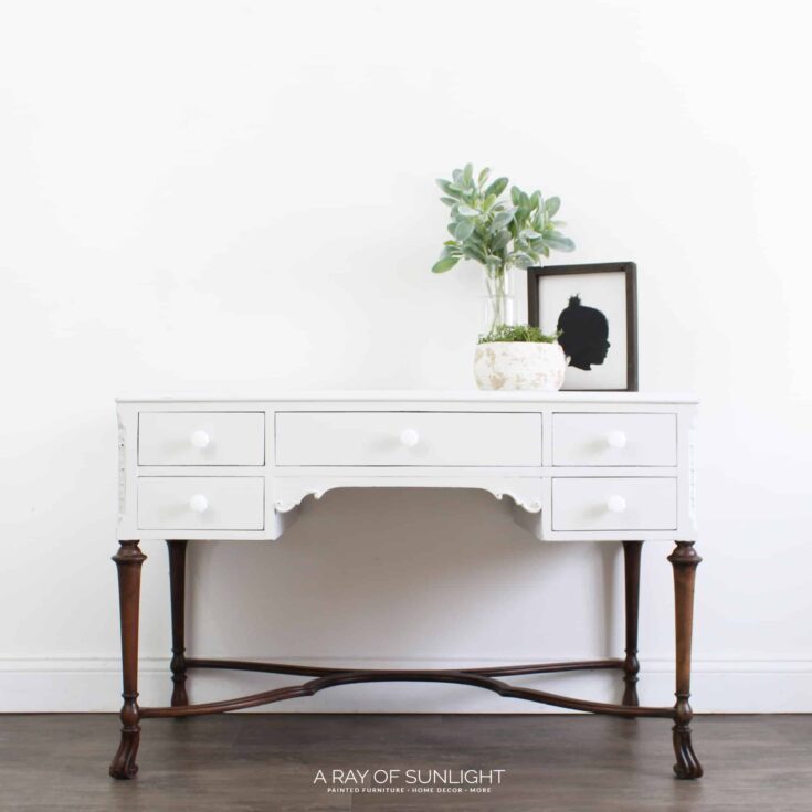 gray chalk painted desk with stained wood legs