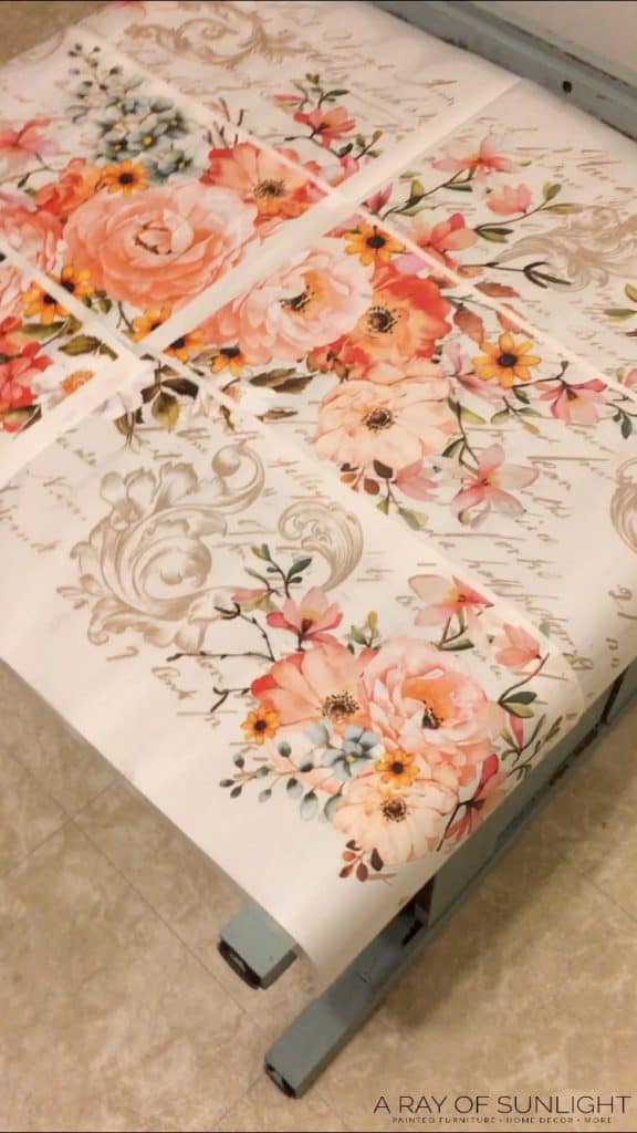 Dresser on its back with floral transfers on top