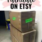 Three large cardboard boxes labeled FRAGILE stacked below a sign reading How to Ship Furniture on Etsy.