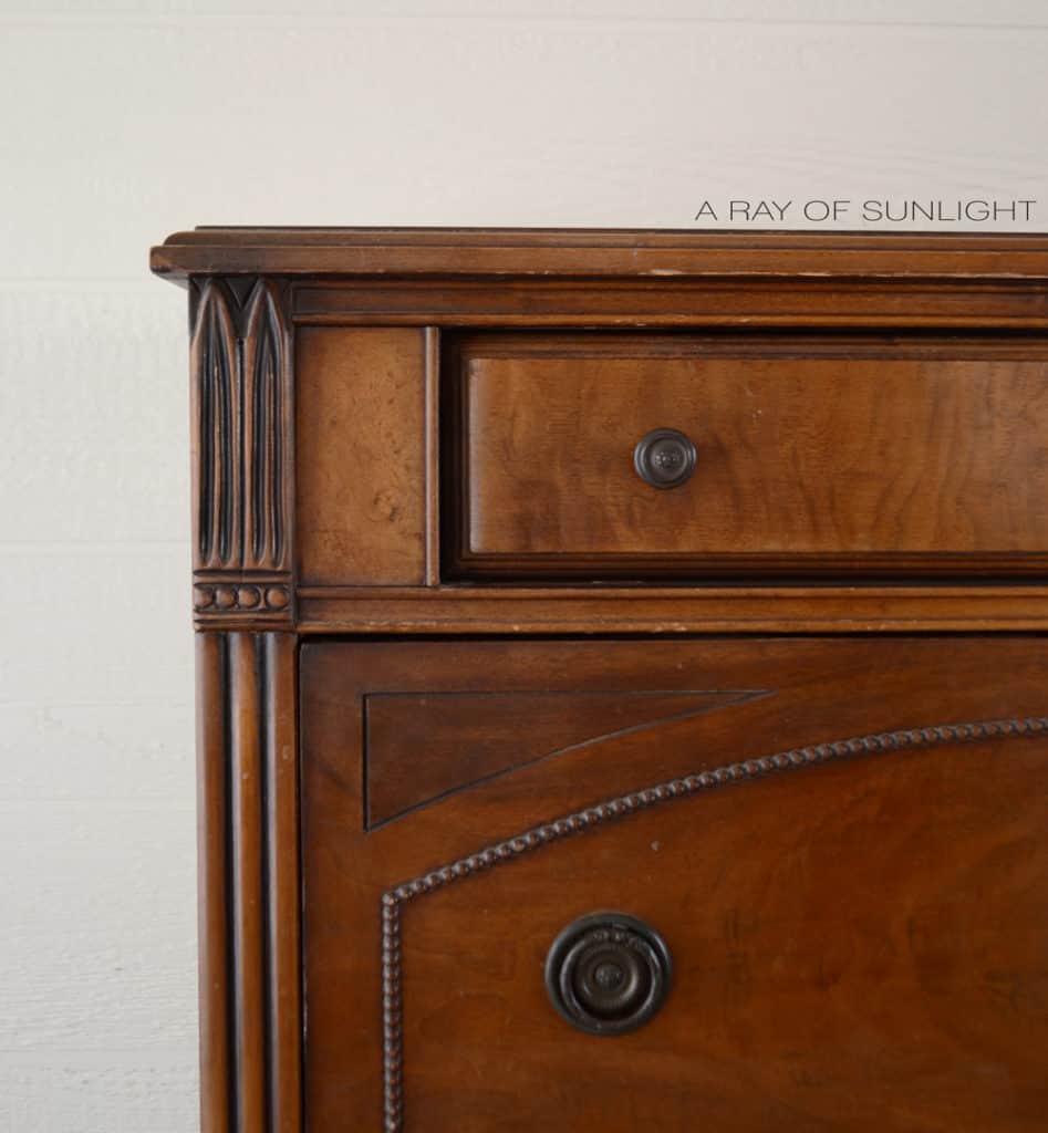 Closeup of antique dresser with fixed trim