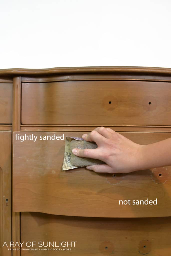 scuff sanding a drawer with 220 grit sandpaper