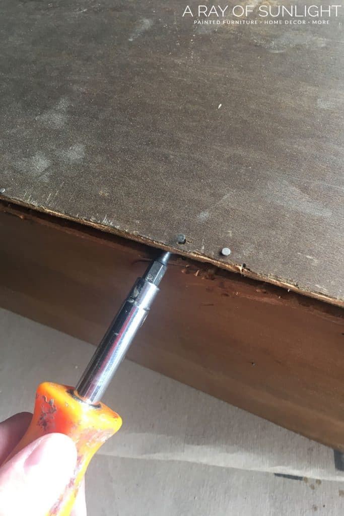 Remove nails to remove bottom from drawer