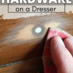 Hand sanding a wooden dresser drawer, with text: How to Change Hardware on a Dresser.