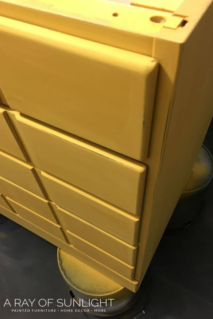 closeup of Mustard yellow chalk painted card catalog dresser