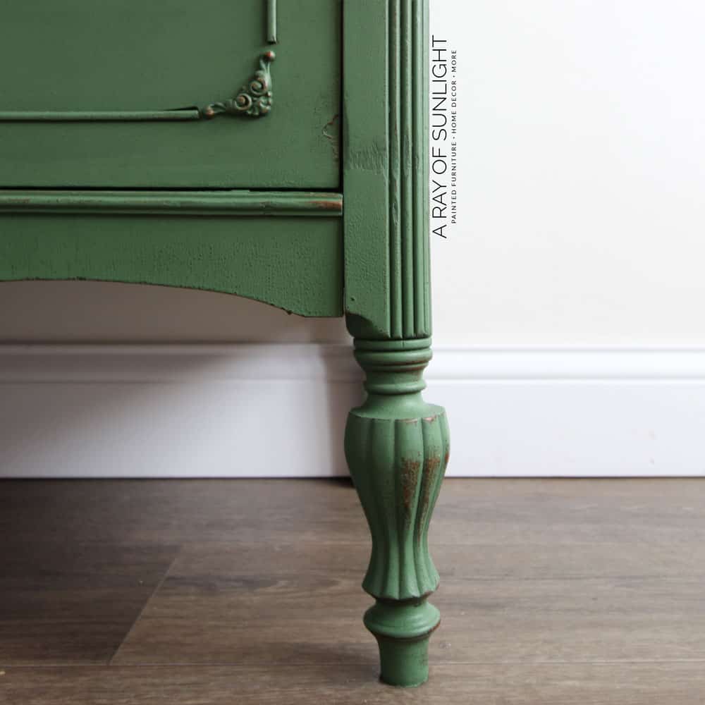 closeup of emerald green painted dresser leg