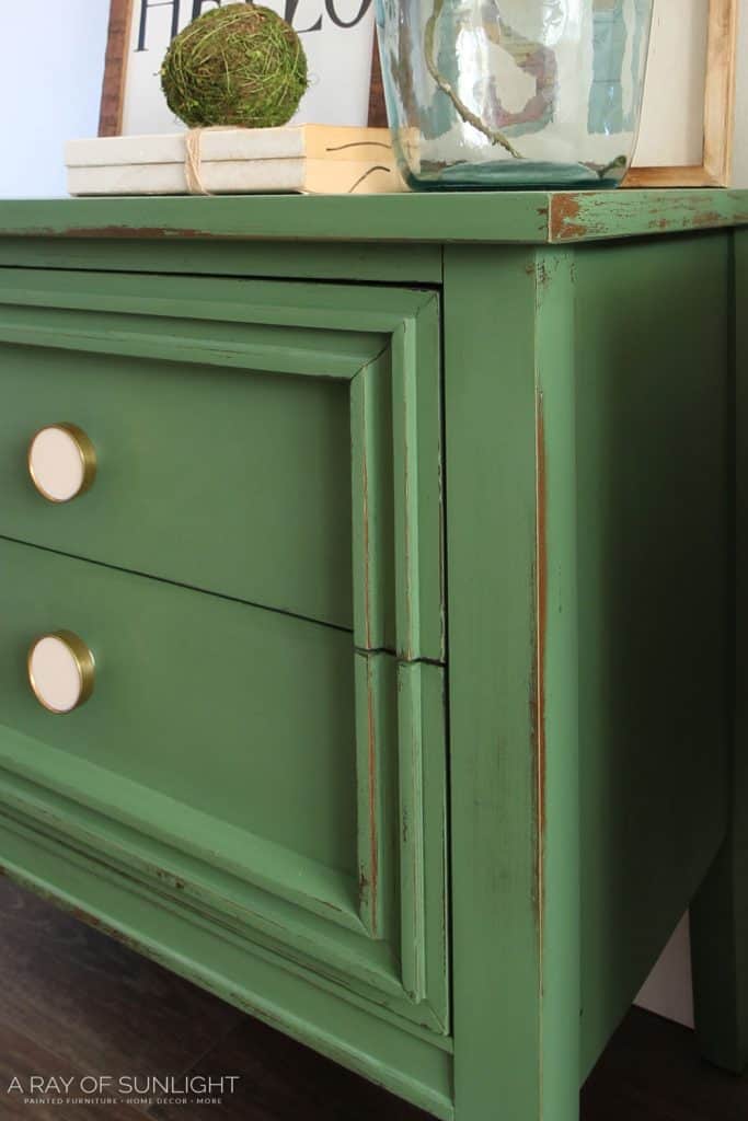 closeup of emerald green distressed nightstand