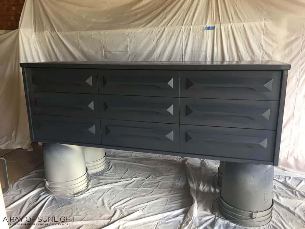 dresser painted with navy blue paint