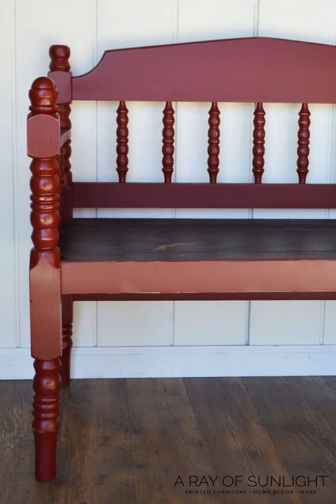 closeup of red porch bench painted for outside