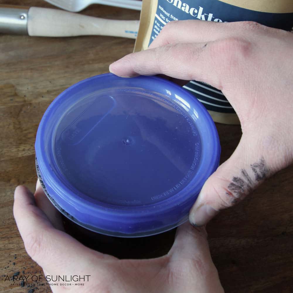 secure the lid of plastic container with milk paint and water