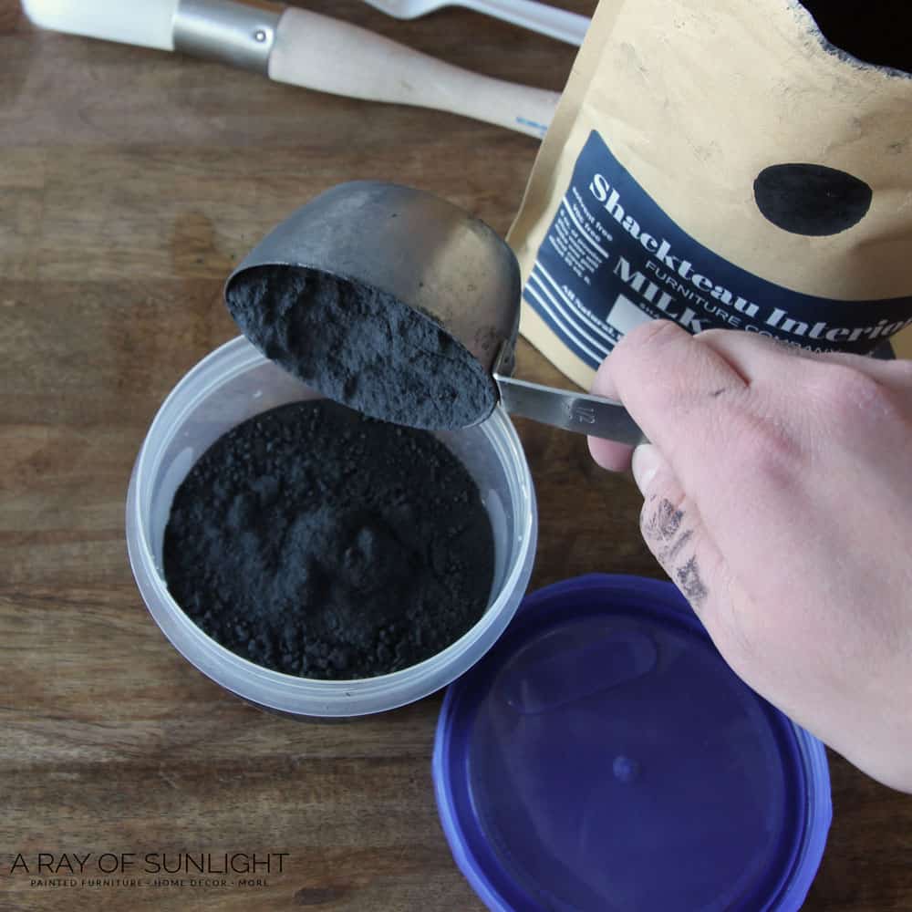 add powdered milk paint to water in plastic container