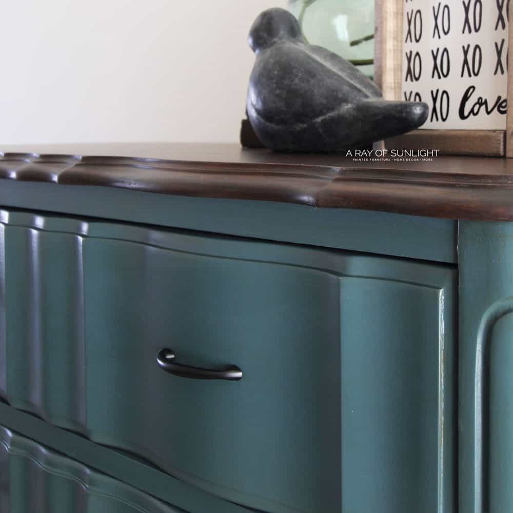 Closeup of teal blue French Provincial Dresser with Modern Hardware