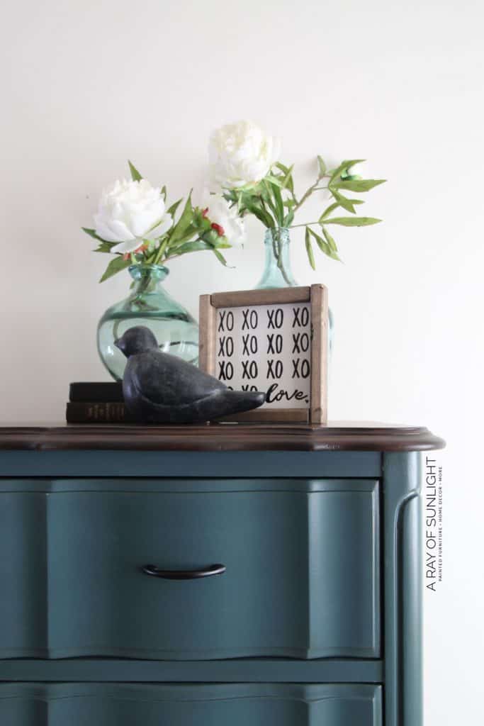 closeup of teal blue dresser with gel stained top