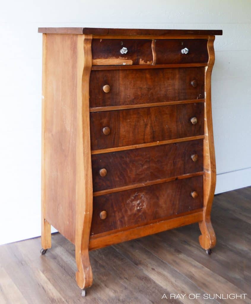 Dresser with chipped veneer on the drawers