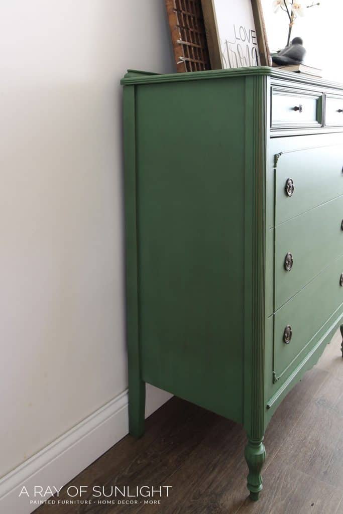Green painted tall dresser after being repaired with Bondo