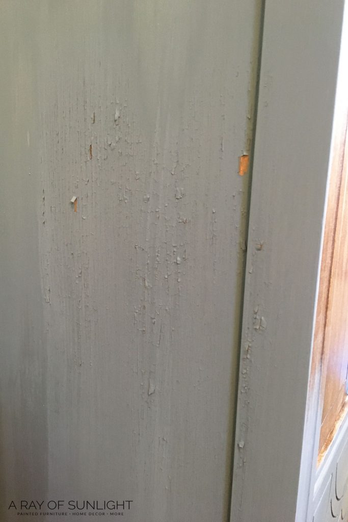 chipping milk paint on hutch before sanding with 220 grit
