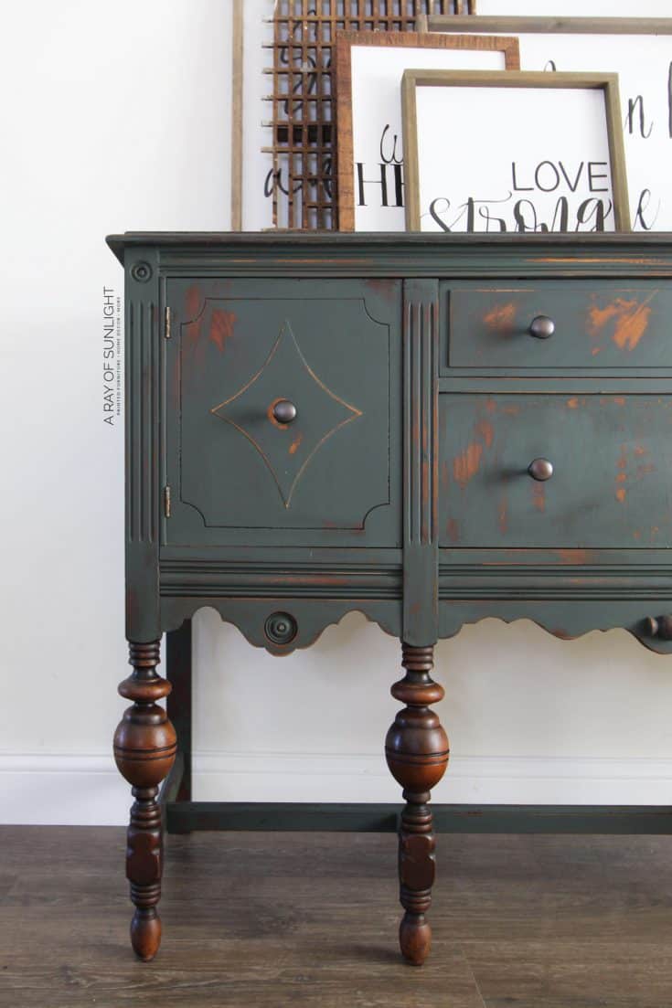 dark green painted buffet with stained wood legs