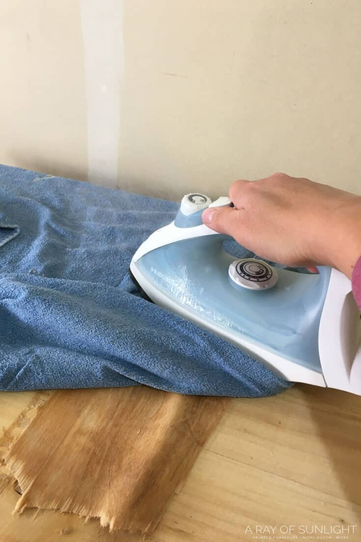 hot iron on wet towel to loosen veneer
