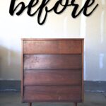 A wooden dresser with four drawers before makeover