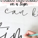 Hand tracing script letters on paper for a sign; text above reads How to Paint Letters on a Sign.