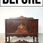 A dark wooden vintage cabinet stands below a large sign that reads BEFORE in bold letters.