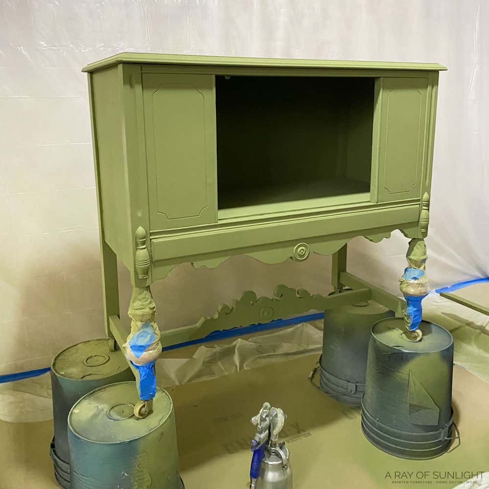 buffet painted olive green in paint booth