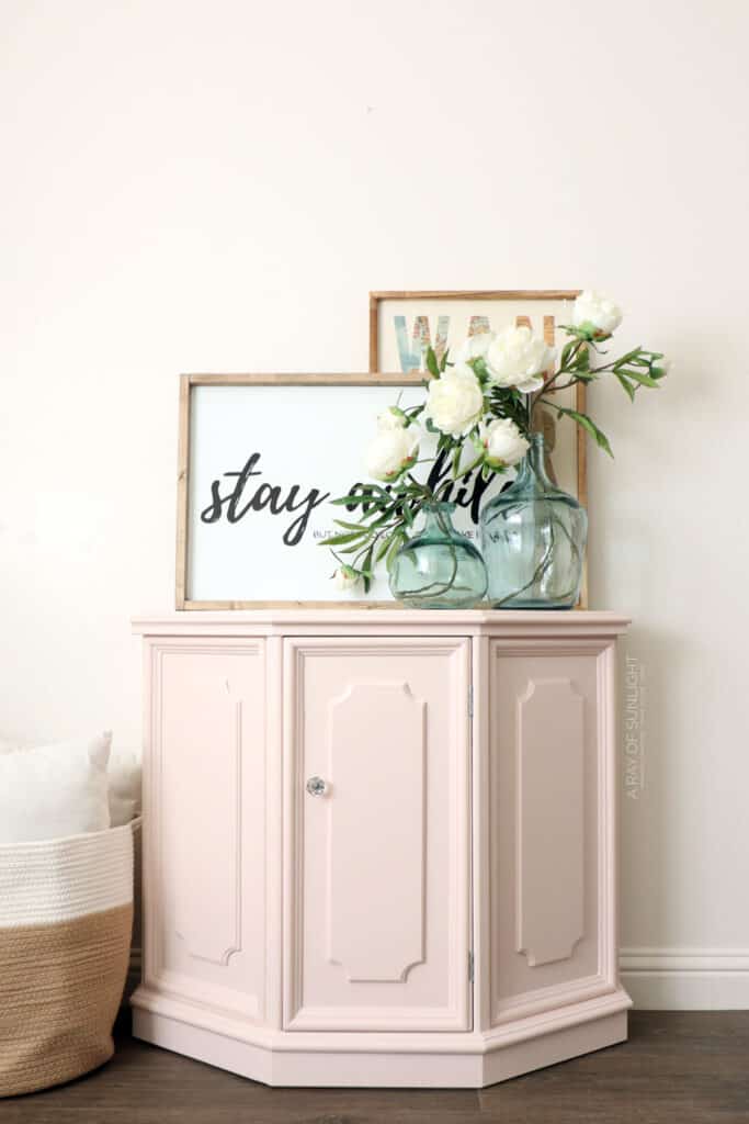 Pink painted hallway cabinet