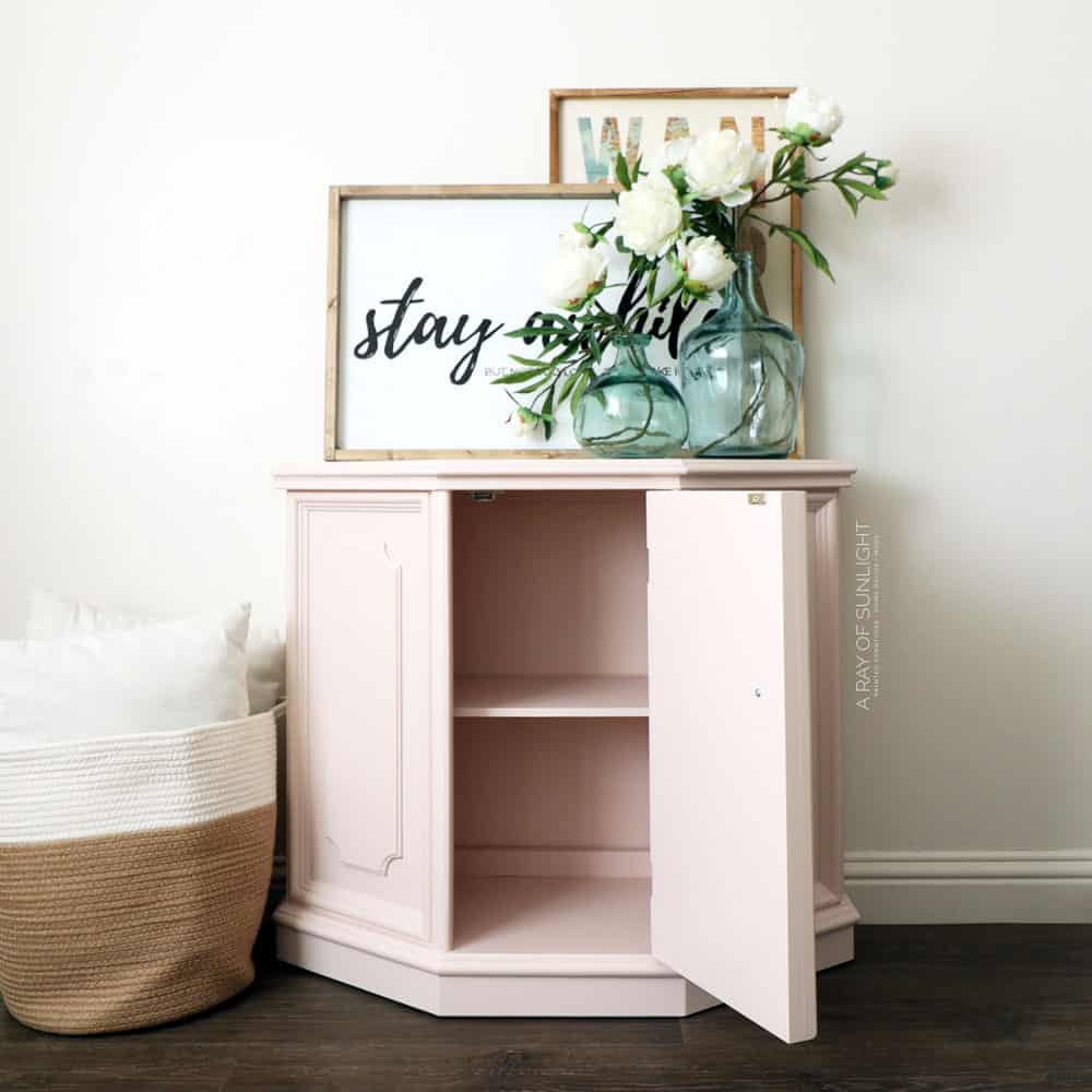 pink painted cabinet with door open