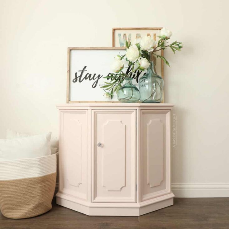 muted pink painted cabinet