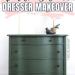 A dark green dresser with black knobs, topped with a bird figurine and a vase, against a white wall.