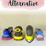 Four different power sanders are lined up side by side on a white surface under the text SURFPREP SANDER Alternative.