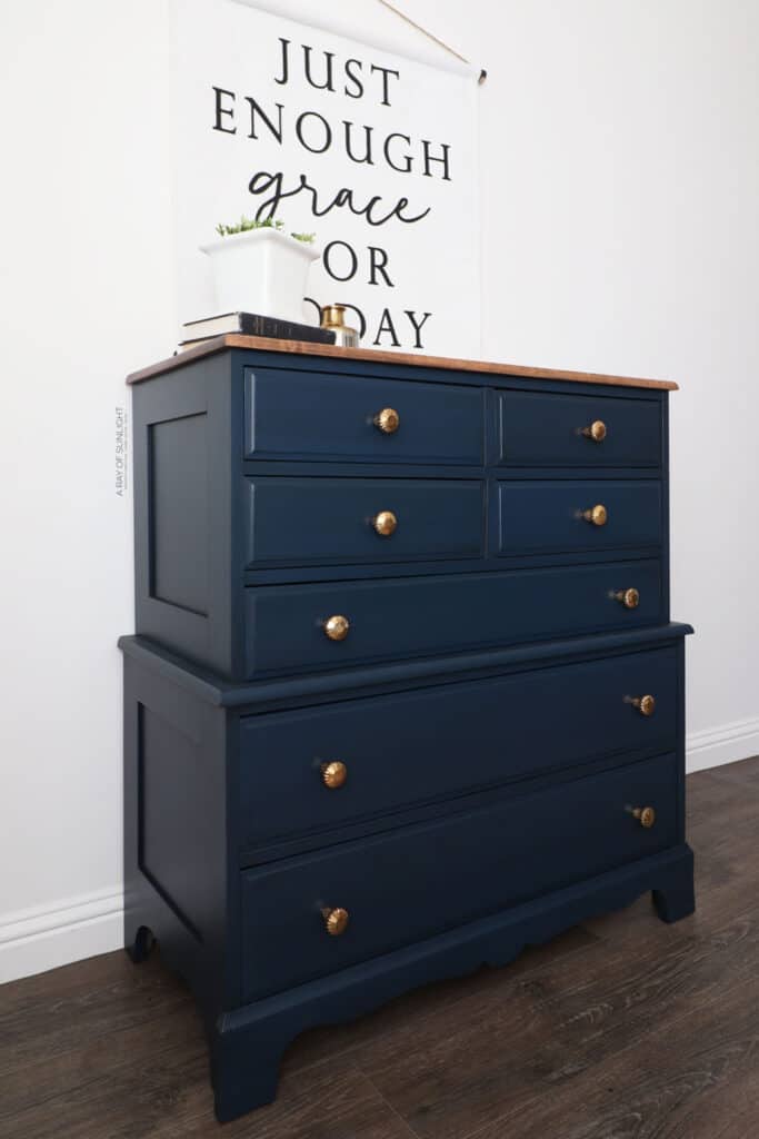 Side view of blue painted glazed dresser with gold hardware