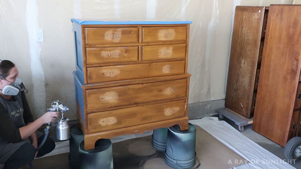 Using a Fuji paint sprayer to paint the dresser