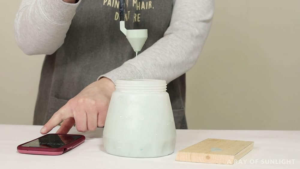 timing how long paint takes to drain from viscosity cup