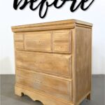 A newly stripped raw wood dresser before makeover