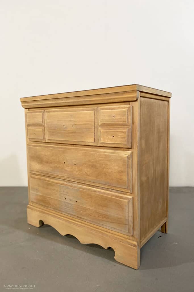 Wood dresser after stripping paint
