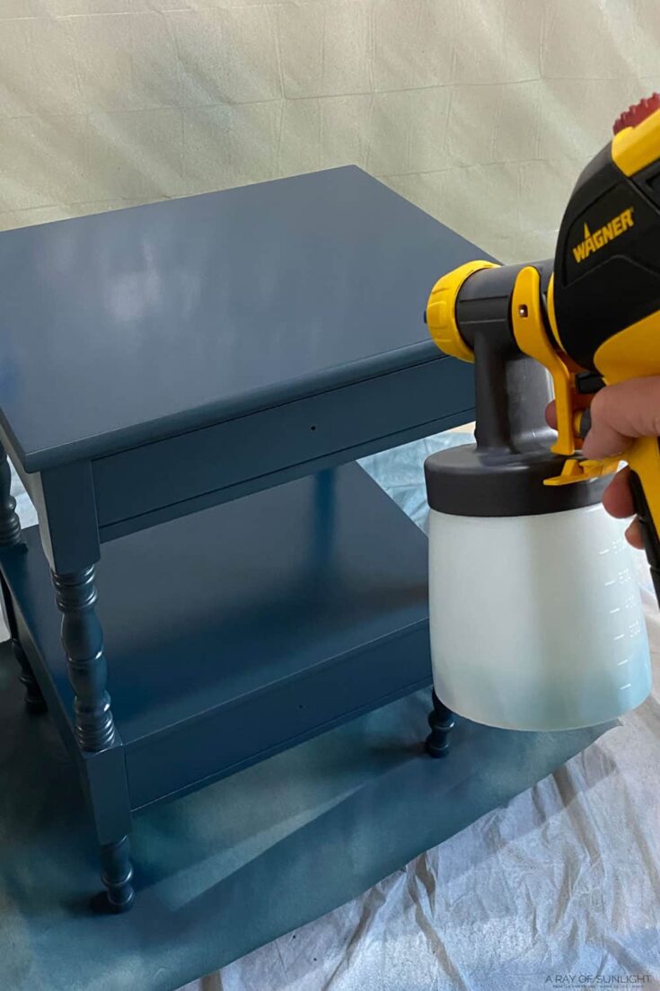 spraying paint onto furniture with wagner sprayer