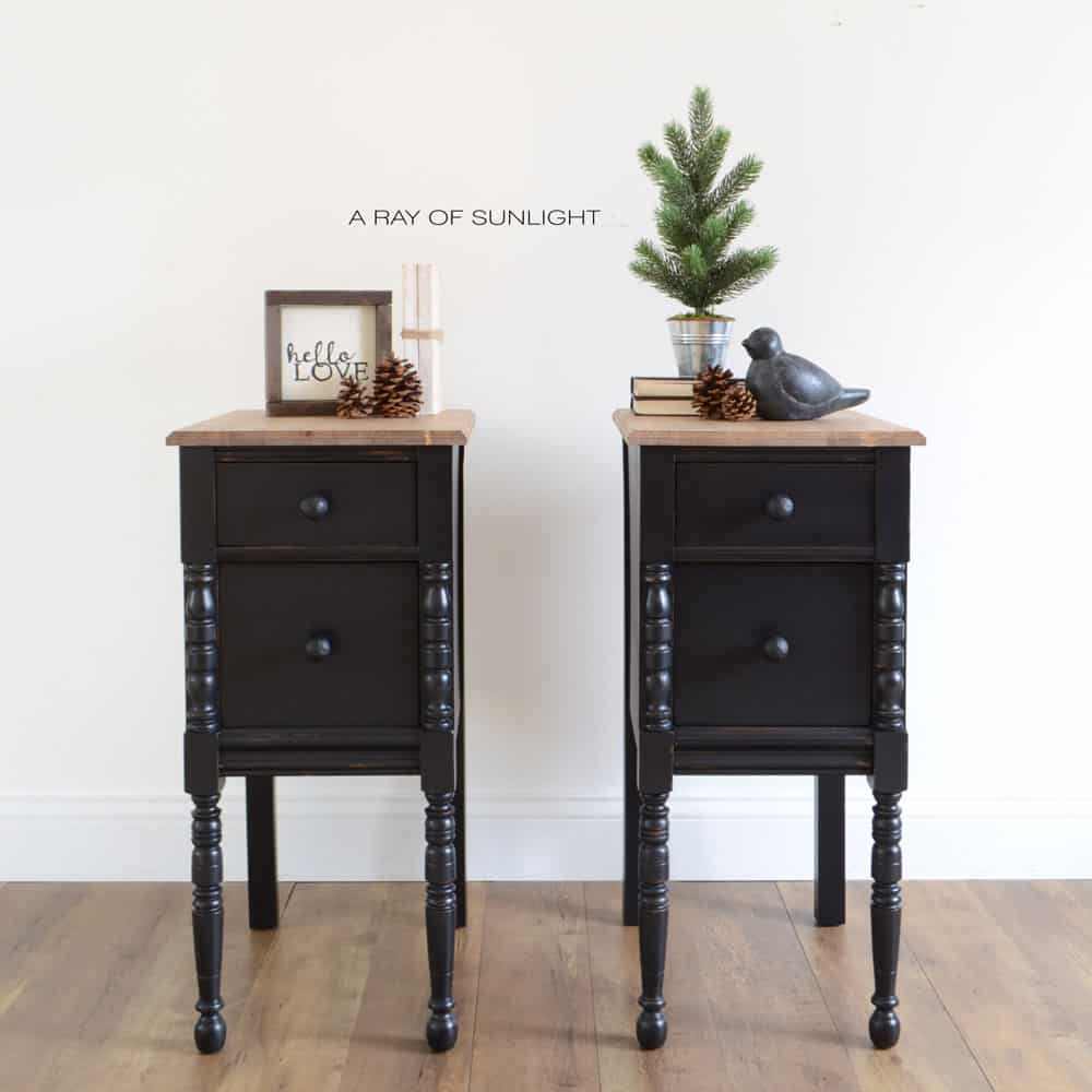 black painted farmhouse style nightstands with black knobs and wood tops