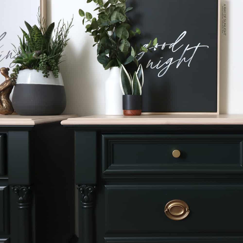 closeup shot of the green painted nightstands with whitewashed wood top