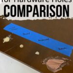 A board labeled with tape compares wood filler, dowel, Kwikwood, and Bondo used to fill hardware holes.