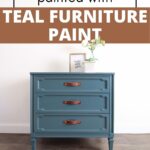A vintage dresser painted teal with brown handles, sitting against a white wall on a wooden floor.